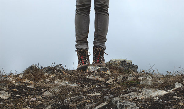 standing on mountain top